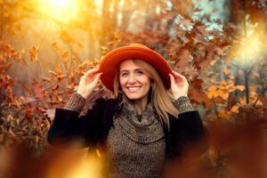 smiling woman in red hat