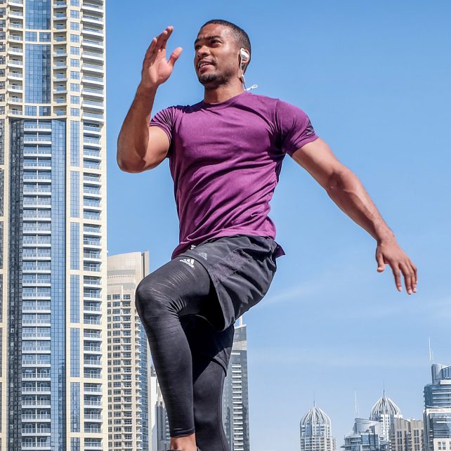 Man jogging with headphones.