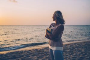 woman on a beach at sunrise